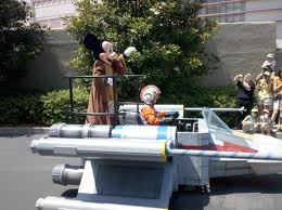 Mickey rides an X Wing Fighter